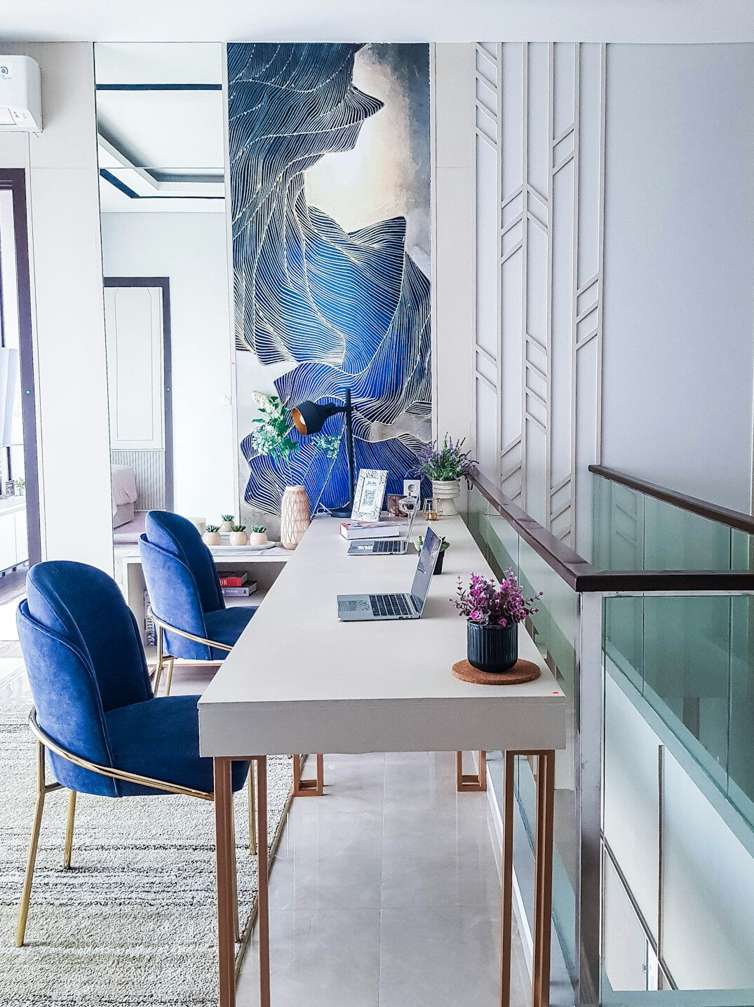 Boutique real estate office interior with oak furniture and ocean light in Punta del Este