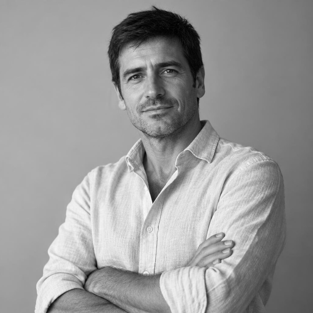 Studio portrait of an Argentine man in his forties, real estate agent in business casual attire